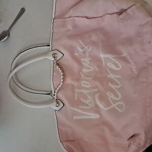 Pink and white zippered bag